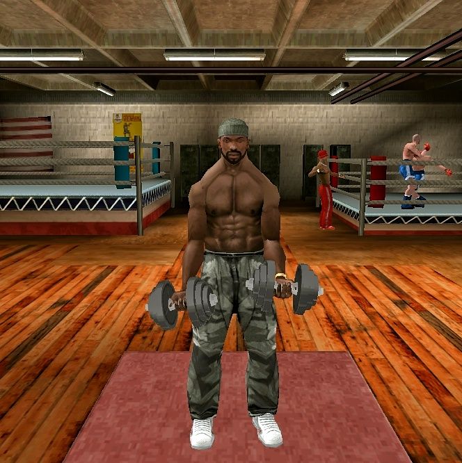 CJ lifting dumbbells at the gym